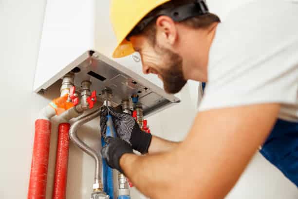 Technician Installing Boiler At Home